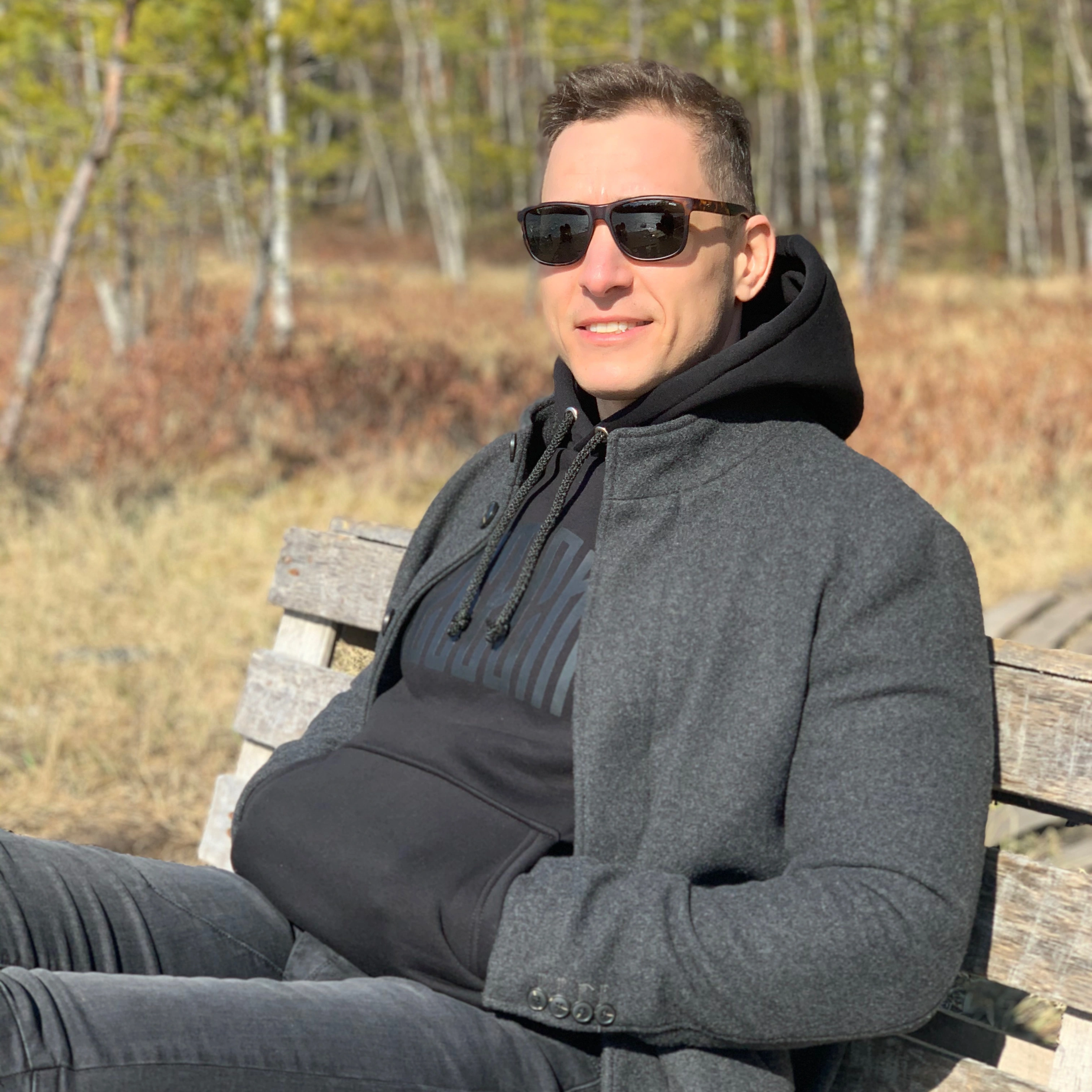 Homeowner relaxing outdoors wearing sunglasses